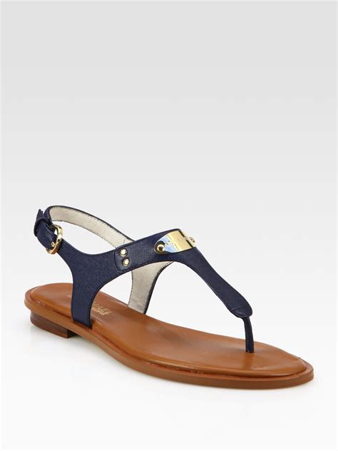 Michael michael kors mk plate thong sandals .